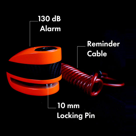 The image showcases a security disc lock alarm system, characterized by its vivid orange color and robust construction. The alarm is marked to have a high decibel level of 130 dB, suggesting it can produce a loud alert to deter theft. The 10 mm locking pin adds to the security features, providing a substantial locking mechanism that integrates with the visual and auditory theft deterrents. The lock’s compact design suggests it's easily portable, making it a practical solution for on-the-go security