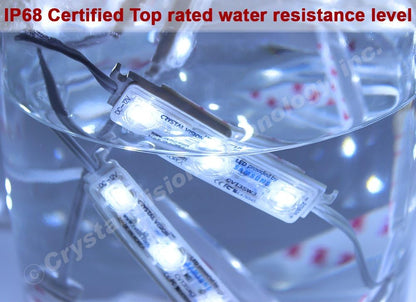The image depicts LED modules by Crystal Vision submerged in water, demonstrating their IP68 certification, which indicates top-rated water resistance. The LEDs are shown functioning underwater, signifying their durability and suitability for outdoor or wet environments.