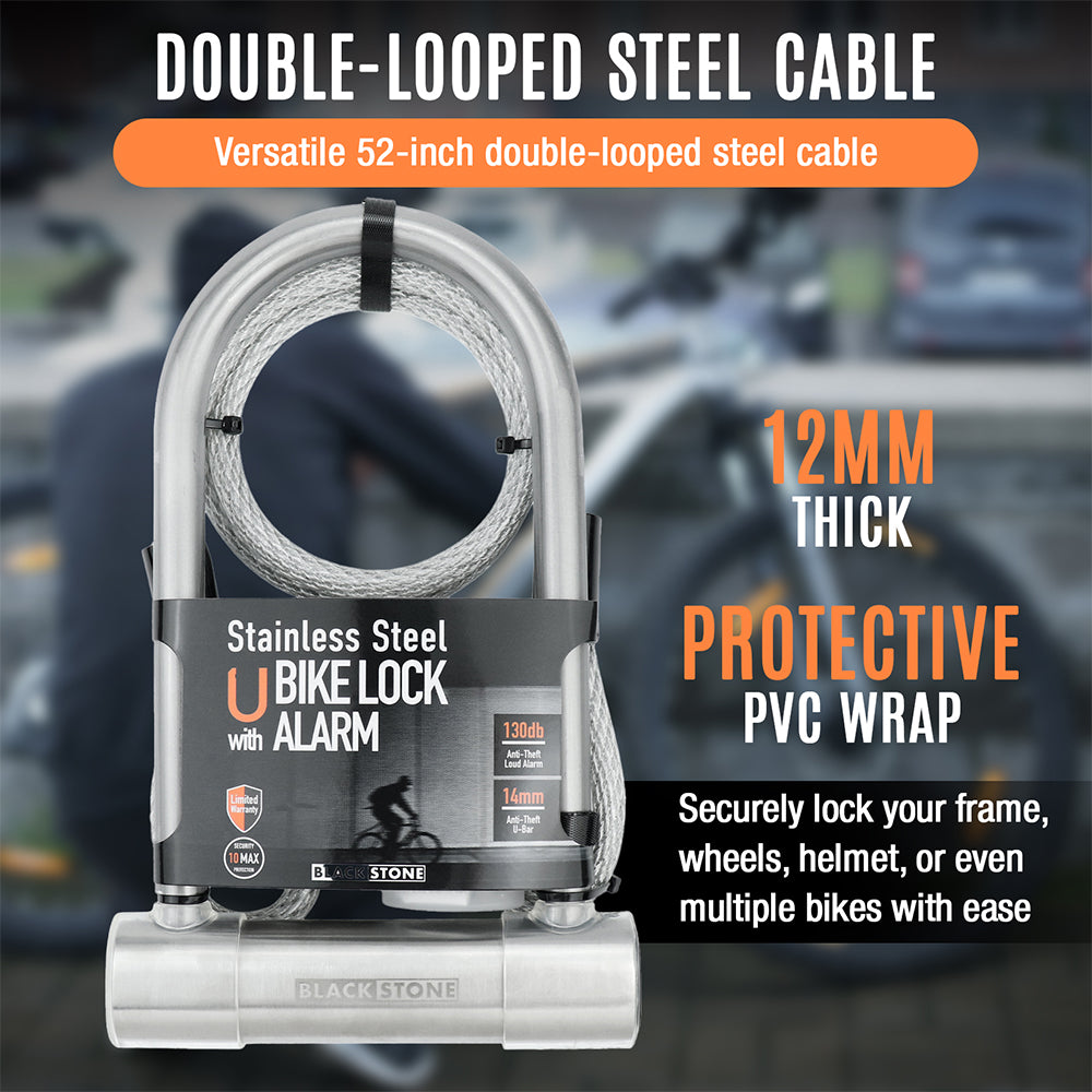 Black Stone stainless steel U bike lock featured with a 52-inch double-looped steel cable and protective PVC wrap, advertised as 12mm thick for secure locking of bikes and gear, against a blurred urban background