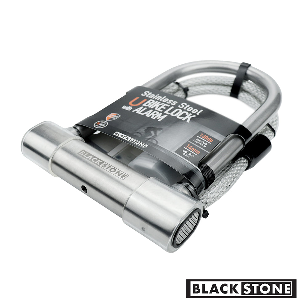 Angle view of Black Stone stainless steel U-shaped bike lock with an integrated alarm system and a coiled cable, against a white background with the brand's logo