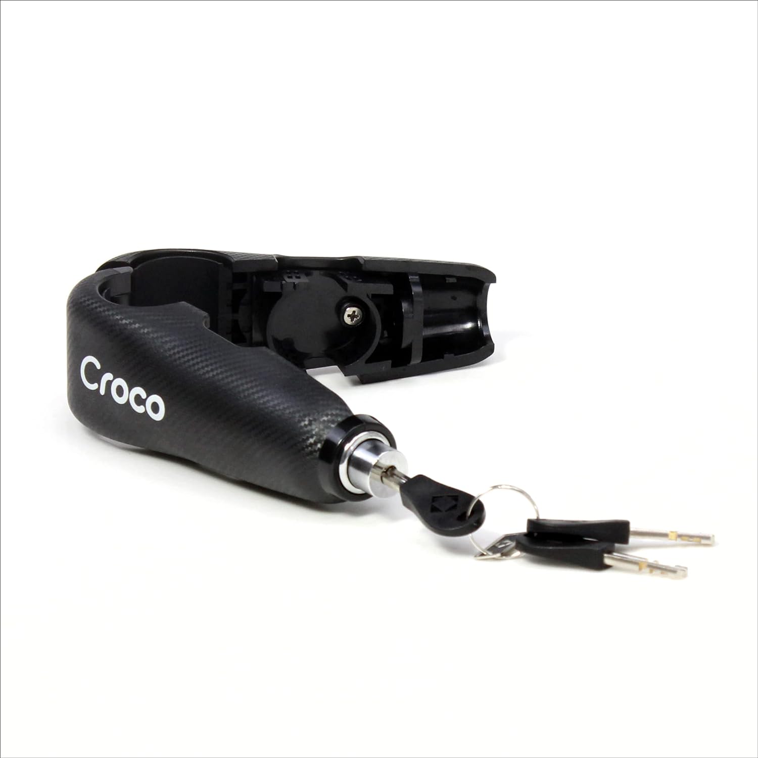 The image presents a black Croco bike lock with an inserted key, partially revealing its internal mechanism. The lock is textured to resemble carbon fiber, and the Croco branding is prominently displayed. It seems to be a bar lock, commonly used for bicycles, which implies a lightweight yet secure design. The photo emphasizes the lock's use-case scenario and gives a good impression of how it operates with the key in place