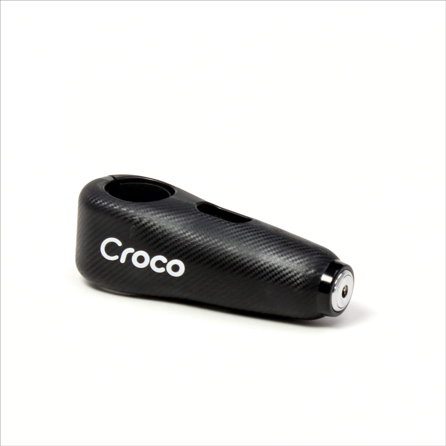 The image shows a close-up view of a black Croco lock with a carbon fiber-like texture on its surface. The lock appears robust and is branded with the Croco logo in white letters, suggesting a focus on strong visual branding. The keyhole is at one end of the lock, hinting at a high-security cylinder mechanism. The design is sleek and modern, and the overall impression is that of a sturdy, reliable lock for securing valuable items