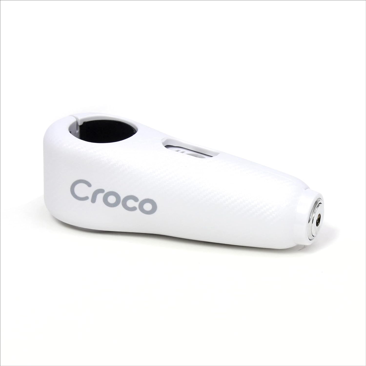 The image shows a close-up view of a white Croco lock with a carbon fiber-like texture on its surface. The lock appears robust and is branded with the Croco logo in white letters, suggesting a focus on strong visual branding. The keyhole is at one end of the lock, hinting at a high-security cylinder mechanism. The design is sleek and modern, and the overall impression is that of a sturdy, reliable lock for securing valuable items