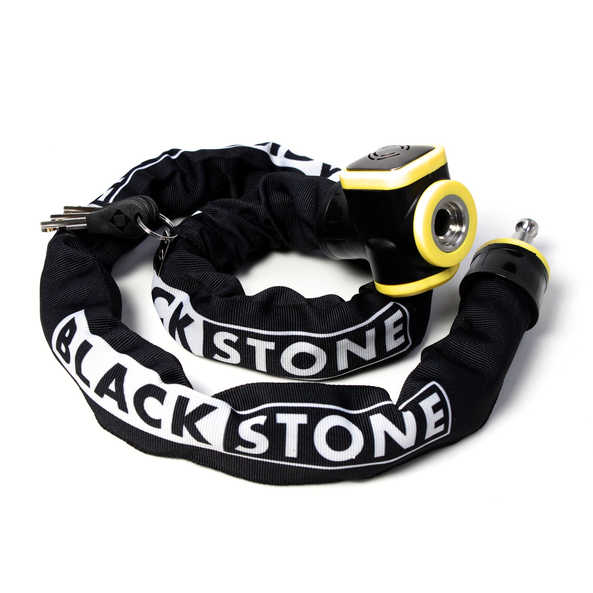 The image displays a Blackstone alarm chain lock laid out in a circular shape against a white background. The chain is protected by a black fabric sleeve with the "BLACKSTONE" logo printed in white, which seems to provide a visual and tactile contrast to the bright yellow alarm unit. The key protrudes from the lock, ready for use, and the entire assembly presents a robust and secure appearance, hinting at the product's purpose for theft prevention. 